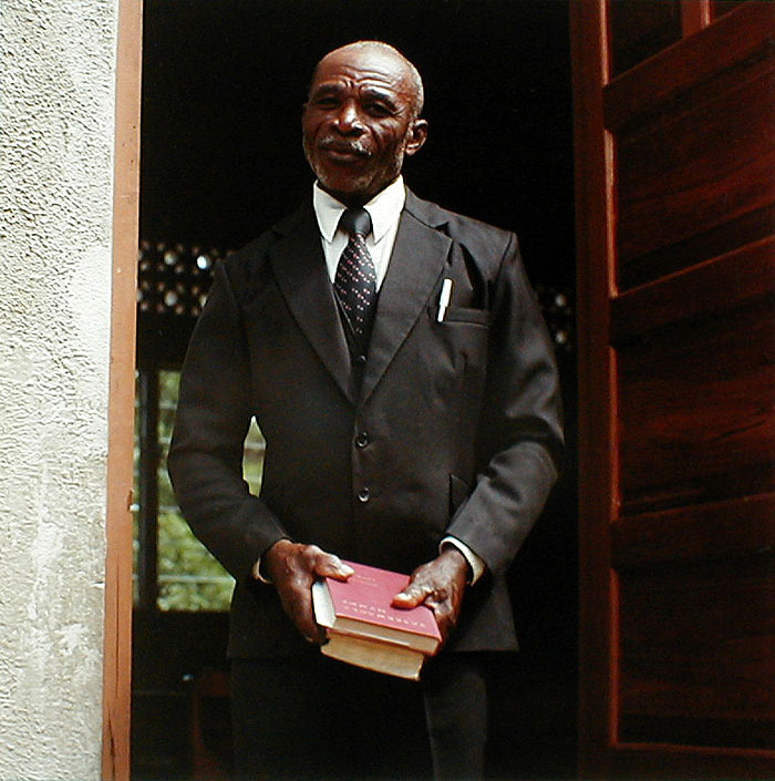 Man in Doorway from Tobago, West Indies by Carol Fisher