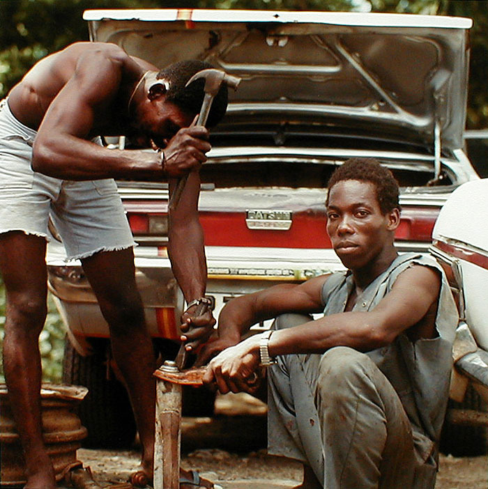 Men Fixing Car from Tobago, West Indies by Carol Fisher