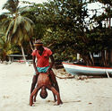 Men Playing on Beach from Tobago, West Indies by Carol Fisher