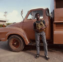 Untitled (Boy and brown truck) from Tobago, West Indies by Carol Fisher
