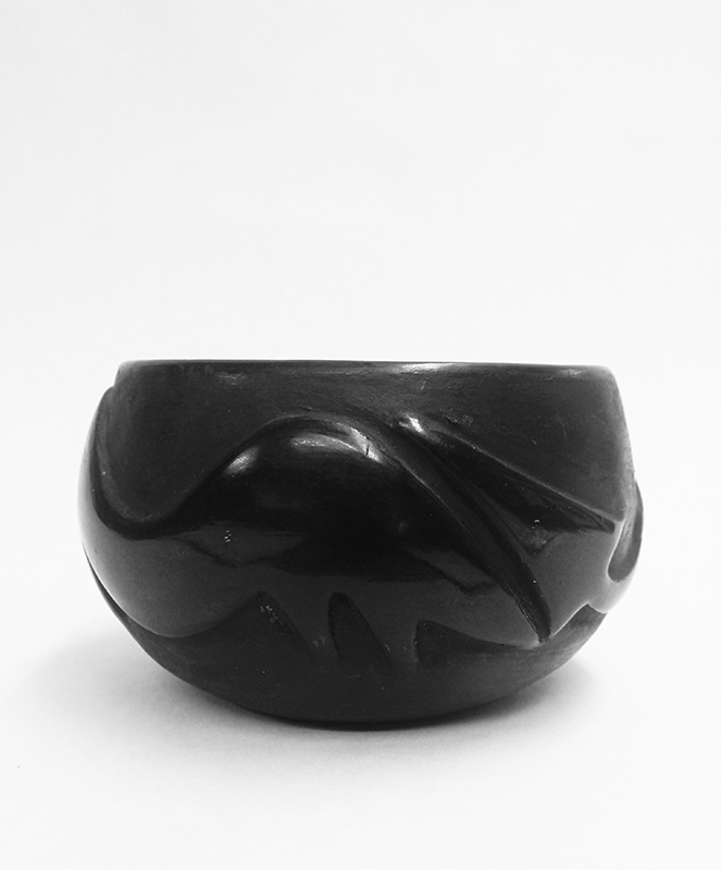 (Carved and polished stoneware with Avanyu figure) by Juanita Wo-Peen Gonzales