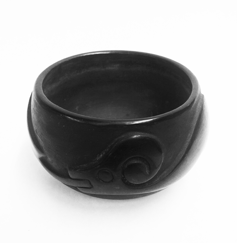 (Carved and polished stoneware with Avanyu figure) by Juanita Wo-Peen Gonzales