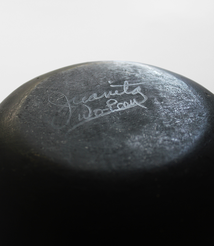 (Carved and polished stoneware with Avanyu figure) by Juanita Wo-Peen Gonzales