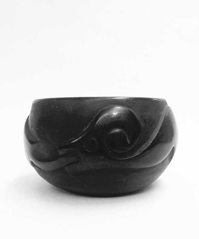 (Carved and polished stoneware with Avanyu figure) by Juanita Wo-Peen Gonzales